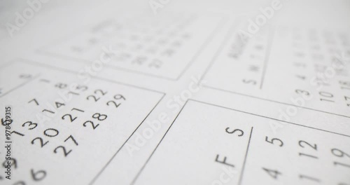 Closeup of calendar with the months of April and August