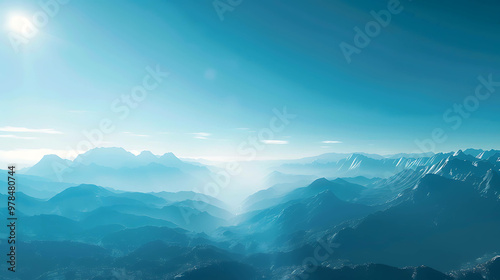 A stunning view of a mountain range with snow-capped peaks against a clear blue sky.