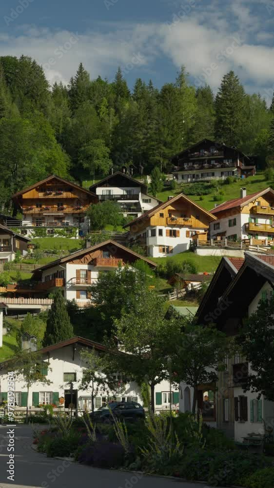 Mittenwald, Bavaria, Germany - A Picturesque Village With Charming Wooden Houses Scattered Across a Hilly Landscape - Medium Shot