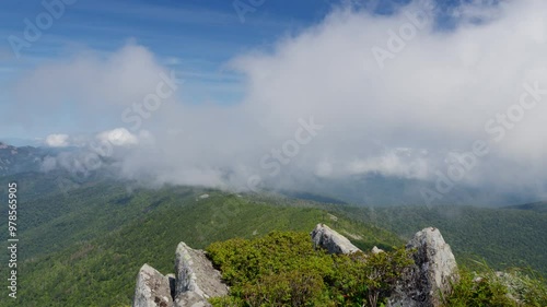 Fog flies over a mountain range. Timelapse.