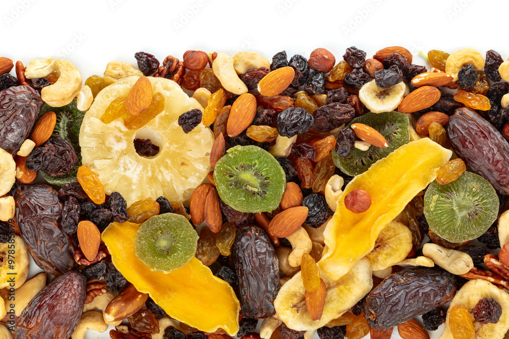 Dried tropical fruits, nuts, and raisins isolated on white. Dried tropical fruits, nuts, and raisins isolated on white.
