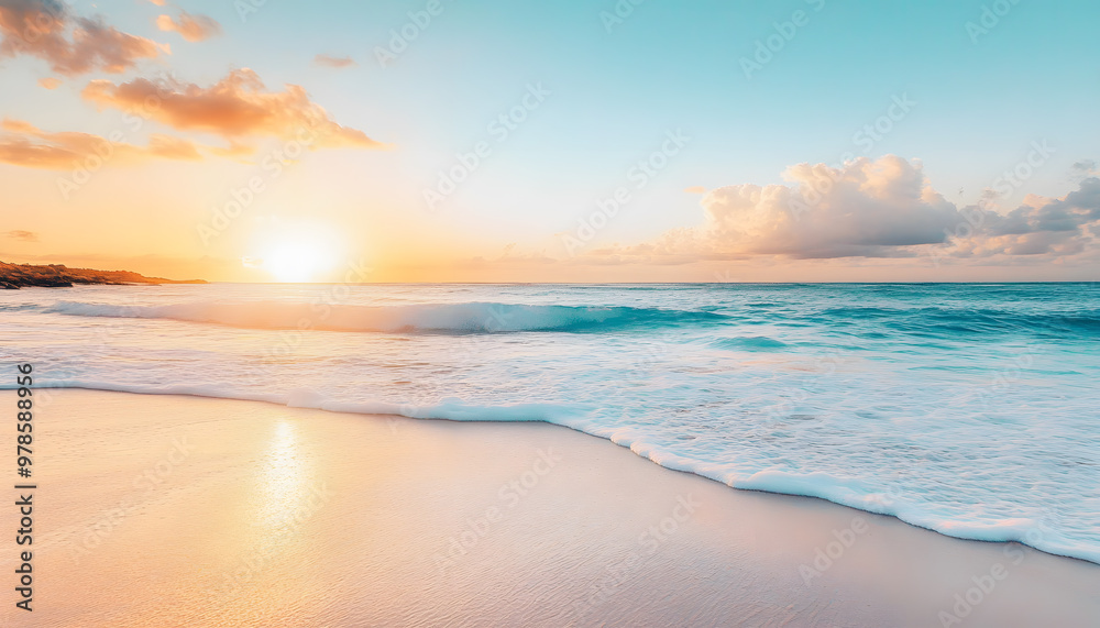 Fototapeta premium Crystal-clear turquoise waters with gentle waves lapping at a pristine beach under a golden sunset