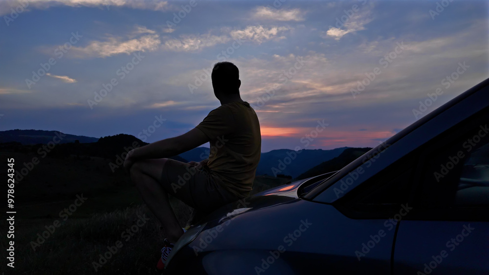 Silhouette of a man leaned to a car in nature looking at mountain landscape. Silhouette of a man leaned to a car in nature looking at mountain landscape.