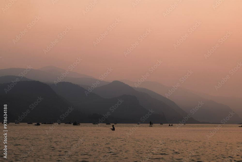 Fishermen on the Columbia River at sunset. Fishermen on the Columbia River at sunset.
