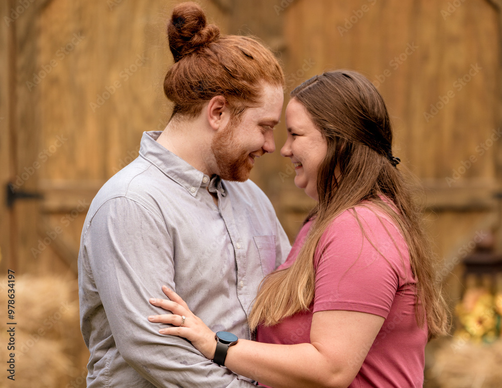Couple smiling at one another in an embrace Couple smiling at one another in an embrace