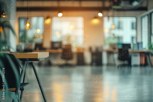 Modern office interior with desks, chairs, and large windows for a collaborative workspace.