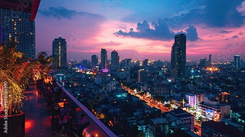 Stunning skyline view at dusk, showcasing vibrant city lights and colorful clouds over a bustling metropolis. photo