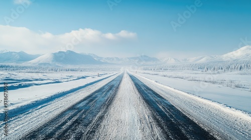 A frozen road in Oymyakon, Russia, stretching into the distance, with snow covering the landscape.