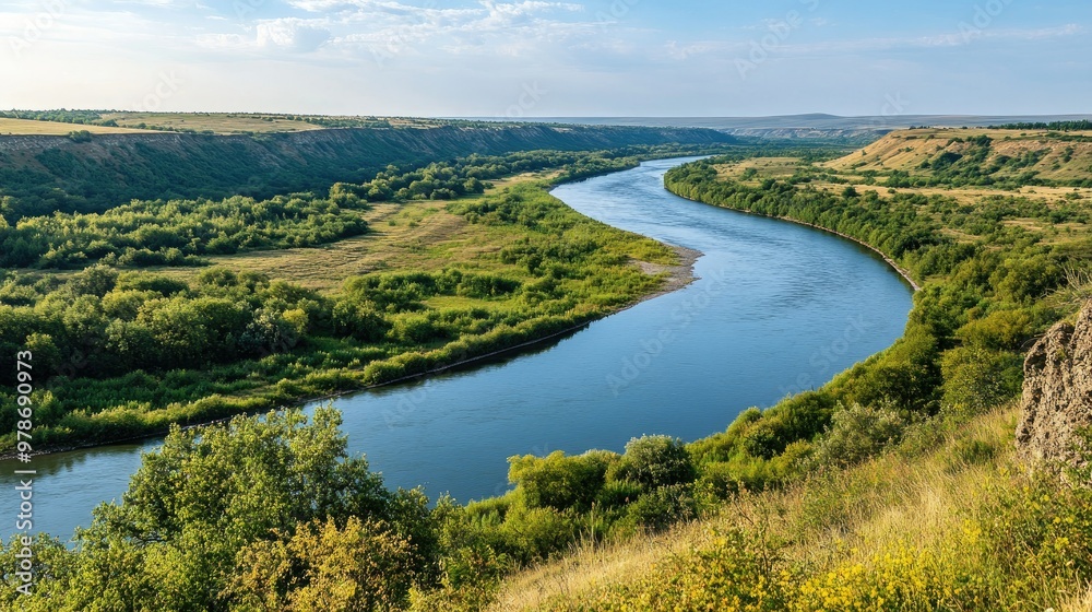 Fototapeta premium A scenic view of the Dniester River flowing through the lush countryside in Moldova.