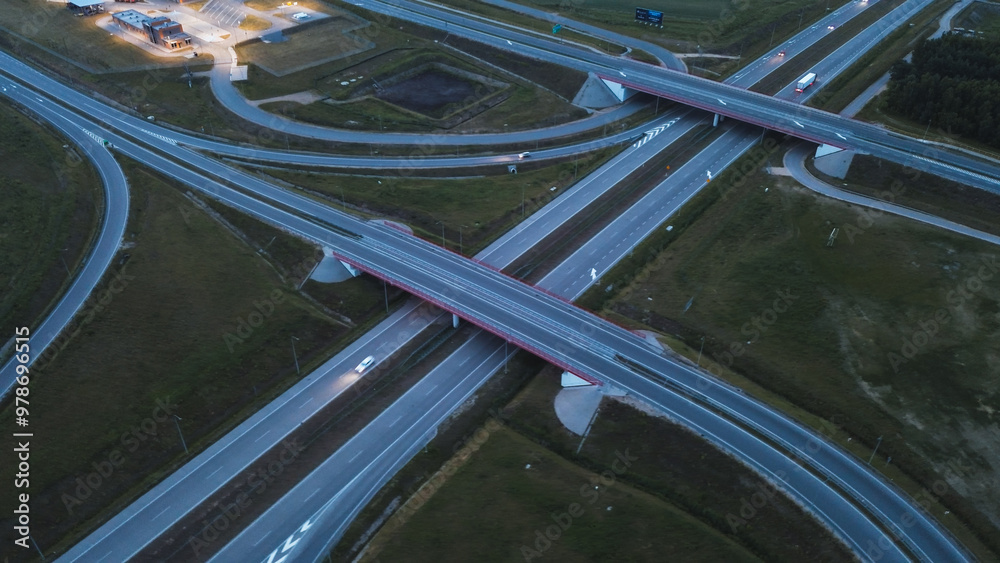 Fototapeta premium Aerial view of highway intersection at dusk