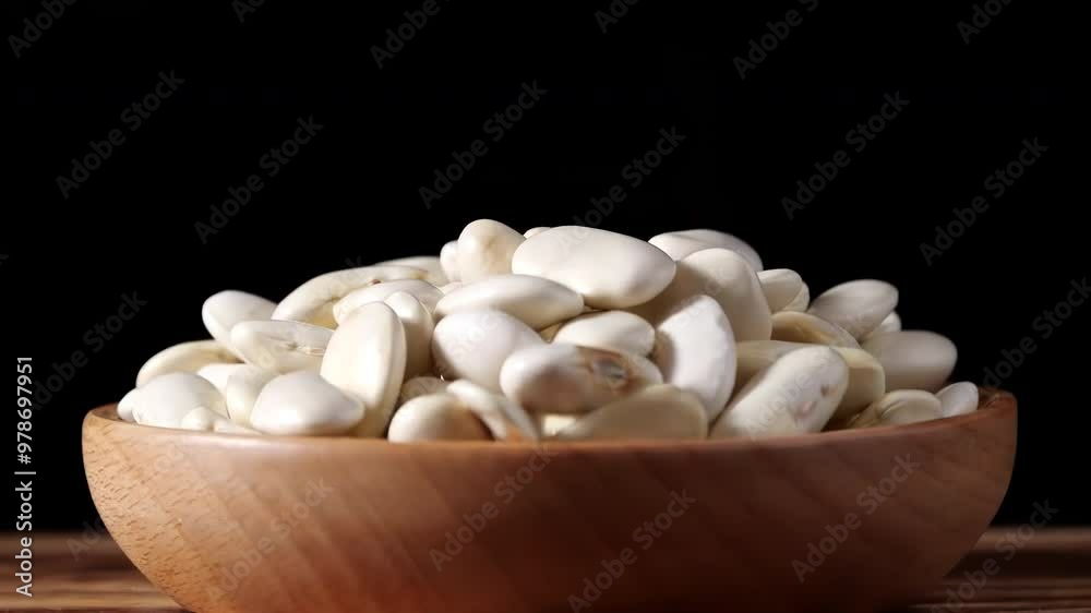 A variety of different colored Raw healthy grain food, Various grains, cereals, beans, legumes are rotated in wooden decoration for advertisement concept. High protein products, Healthy vegan food. A variety of different colored Raw healthy grain food, Various grains, cereals, beans, legumes are rotated in wooden decoration for advertisement concept. High protein products, Healthy vegan food.