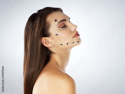 Female person, face and arrows in studio for plastic surgery, chin augmentation and cosmetic procedure. Woman, skincare and rhinoplasty on white background for beauty, liposuction and transformation photo