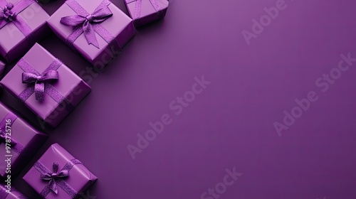 Purple gift boxes arranged neatly on a purple background, with plenty of copyspace for text or design elements