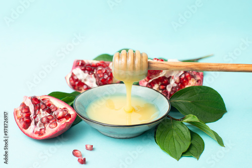 Rosh hashanah, jewish new year holiday, background with pomegranate and honey, traditional food for celebration  photo