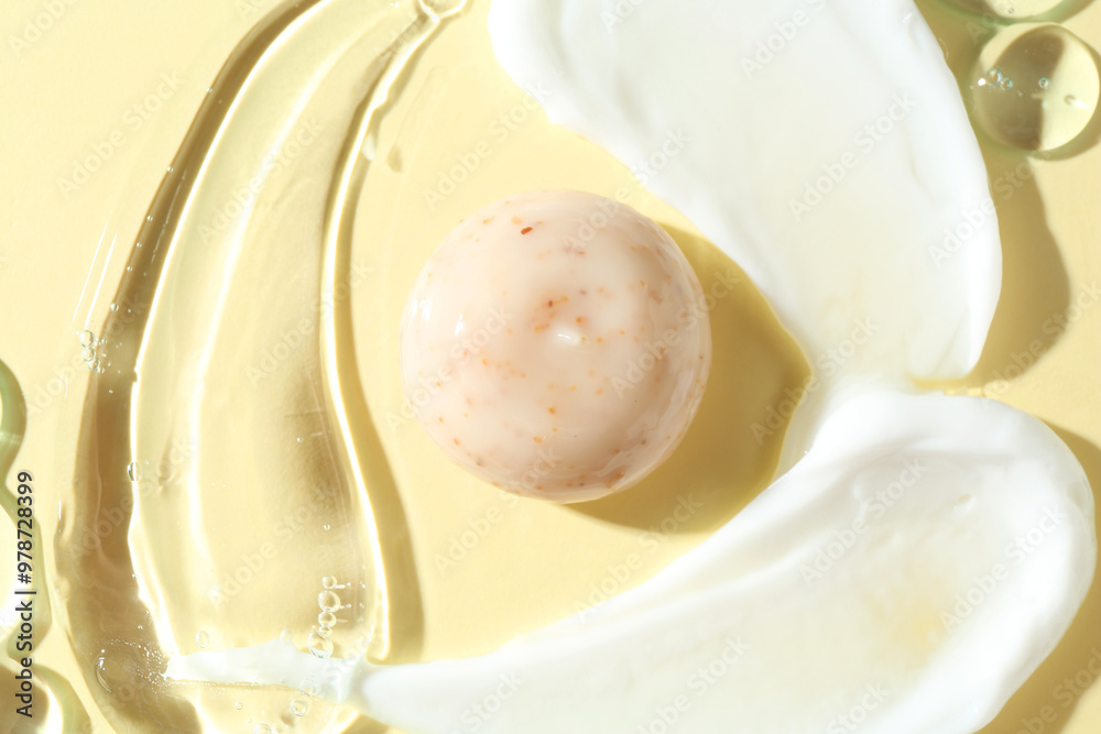 Smears of different cosmetic products on beige background, top view Smears of different cosmetic products on beige background, top view