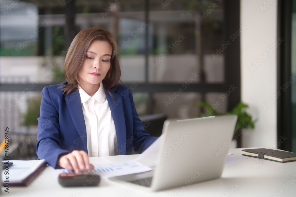 Asian businesswomen reading marketing business document and using calculator calculate statistics to checking finance chart while analyze investment and market stock of new startup in outside office Asian businesswomen reading marketing business document and using calculator calculate statistics to checking finance chart while analyze investment and market stock of new startup in outside office