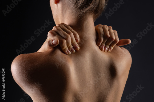 Fotografija woman massaging neck close up, concept of neck pain with osteochondrosis protrus