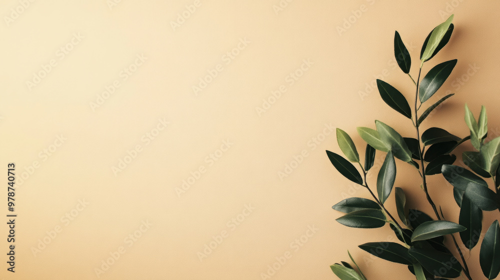 Elegant green leaves against a soft beige background create a calming and minimalist aesthetic in interior design Elegant green leaves against a soft beige background create a calming and minimalist aesthetic in interior design