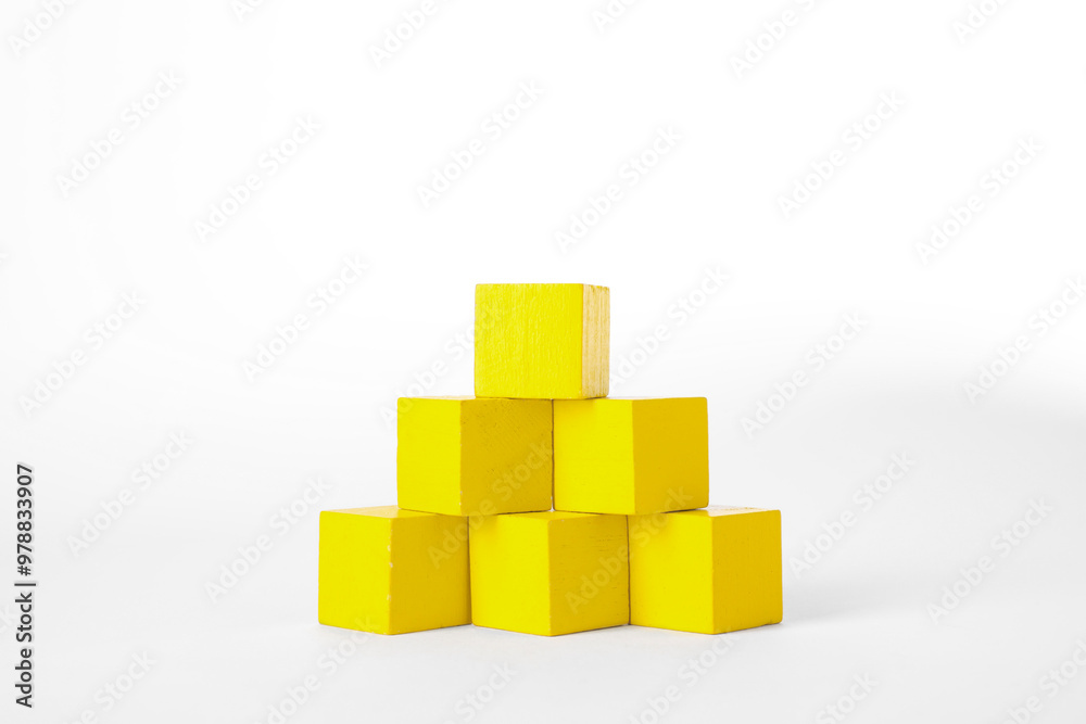 Many yellow wooden cubes isolated on white Many yellow wooden cubes isolated on white