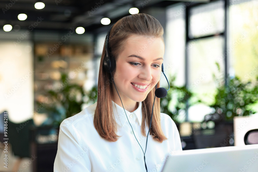 Customer support operator working in a call center office Customer support operator working in a call center office