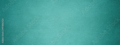 Cyan background from felt textile material with vignette. Structure turquoise suede velvet fabric with texture photo