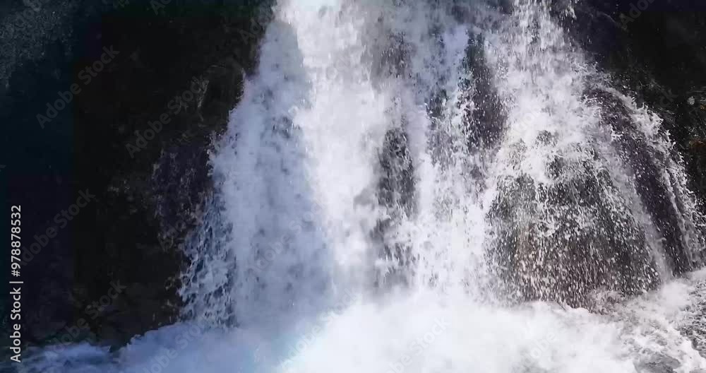 At Waterfall Skutafoss, the gentle waterfall touches the pebbles, creating clear water ripples that dance into the calm river. At Waterfall Skutafoss, the gentle waterfall touches the pebbles, creating clear water ripples that dance into the calm river.