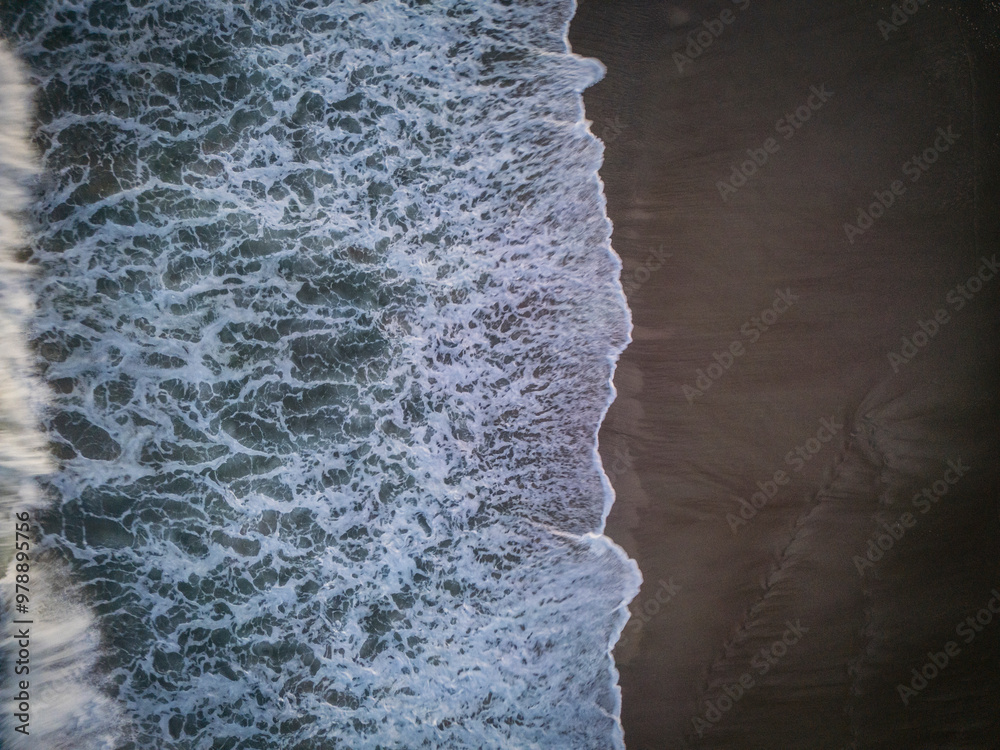 Aerial view of beautiful sandy beach with waves and layers along the coastline of Atlantic Ocean, Pine Knoll Shores, United States. Aerial view of beautiful sandy beach with waves and layers along the coastline of Atlantic Ocean, Pine Knoll Shores, United States.