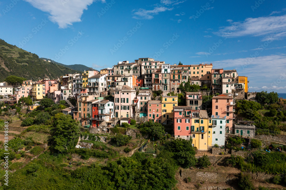 Aerial view of the beautiful medieval town with colorful houses along the coastline, Vernazza, Italy. Aerial view of the beautiful medieval town with colorful houses along the coastline, Vernazza, Italy.