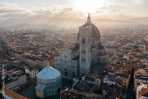 Aerial view of the iconic Santa Maria del Fiore cathedral amidst the beautiful medieval cityscape and colorful rooftops, Florence, Italy. photo