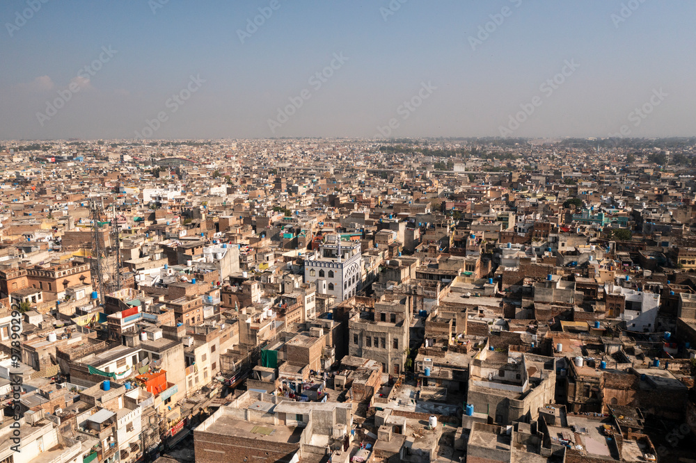 Aerial view of bustling cityscape with dense rooftops and vibrant skyline, Rawalpindi, Pakistan. Aerial view of bustling cityscape with dense rooftops and vibrant skyline, Rawalpindi, Pakistan.