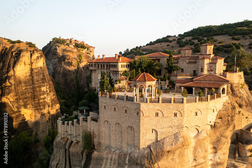 Aerial view of beautiful monasteries perched on rocky cliffs amidst a scenic landscape, Kastraki, Greece. photo