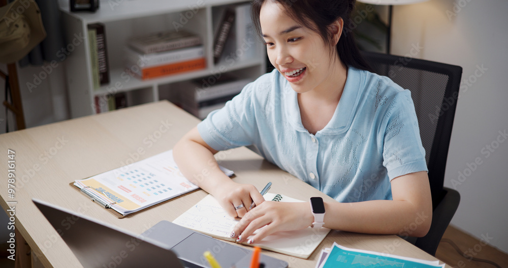 High angle view, Female freelancer enjoying video call with team members via laptop in home office. Working from home, Remote working. High angle view, Female freelancer enjoying video call with team members via laptop in home office. Working from home, Remote working.