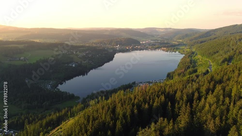 Aerial drone footage of flight along Lake Titisee in the Black Forest in Southern Germany at sunset
