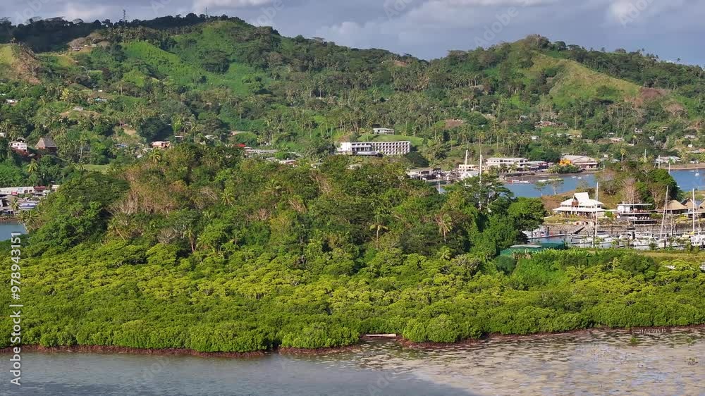 Drone reveal Marina Nawi Island and Savusavu township in rainforest. Vanua Levu coast, Fiji Drone reveal Marina Nawi Island and Savusavu township in rainforest. Vanua Levu coast, Fiji