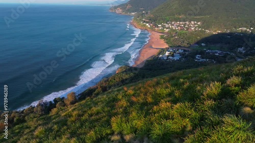 Bald Hill Stanwell Park Beach Tops aerial drone sunrise morning golden hour Sea Cliff Bridge Wollongong NSW Australia Sydney South Coast Illawarra Coalcliff Throull Grand Pacific Drive forward pan up photo