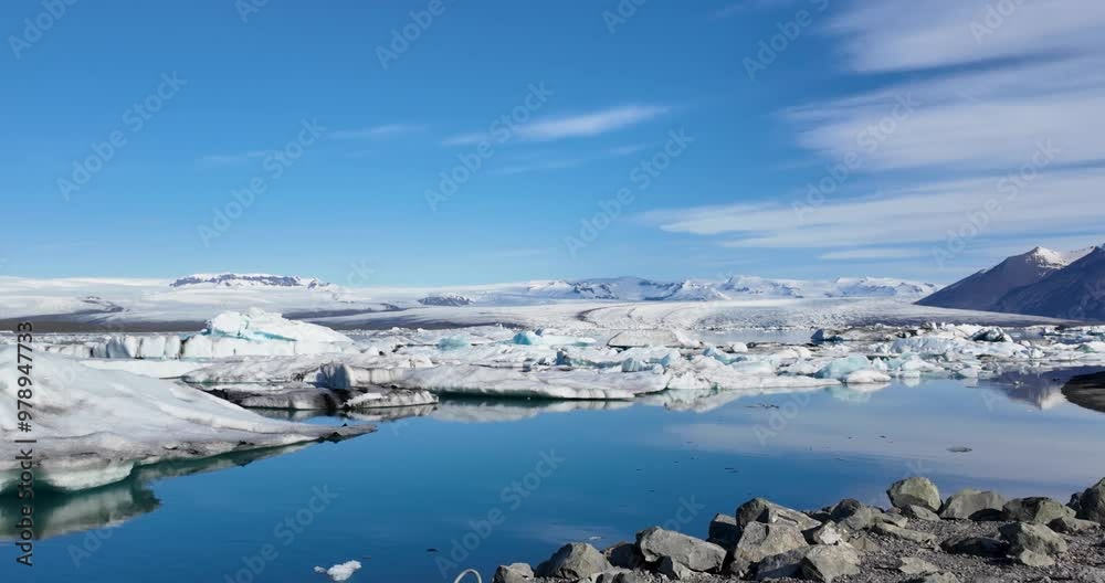 Snow-encrusted mountains provide a breathtaking framework for the picturesque Glacier Lagoon Snow-encrusted mountains provide a breathtaking framework for the picturesque Glacier Lagoon