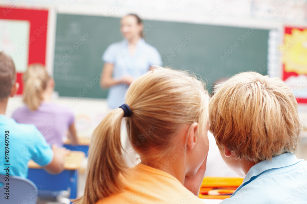 Fototapeta premium Whisper, students and kids in classroom, back and conversation with education, knowledge and talking. Friends, boy and girl in school, gossip and disturb with plan for recess, discussion and children