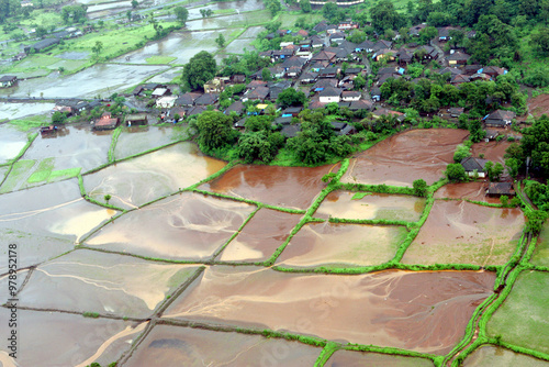 Aerial view of An aerial view of entire village and farming land immersed in water flood rocked in Raigad, Maharashtra, India On July 26th 2005 photo