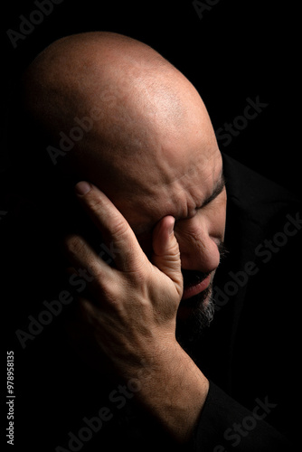 Man distressed by bad news, dark background