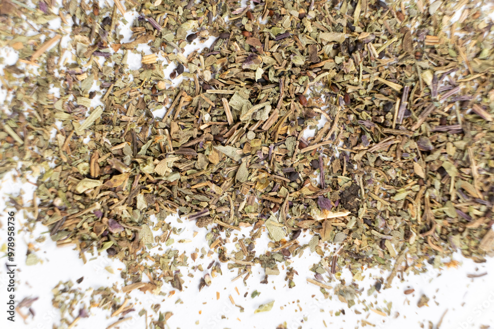 Dry basil spice seasoning macro texture on white background. Dry basil spice seasoning macro texture on white background.