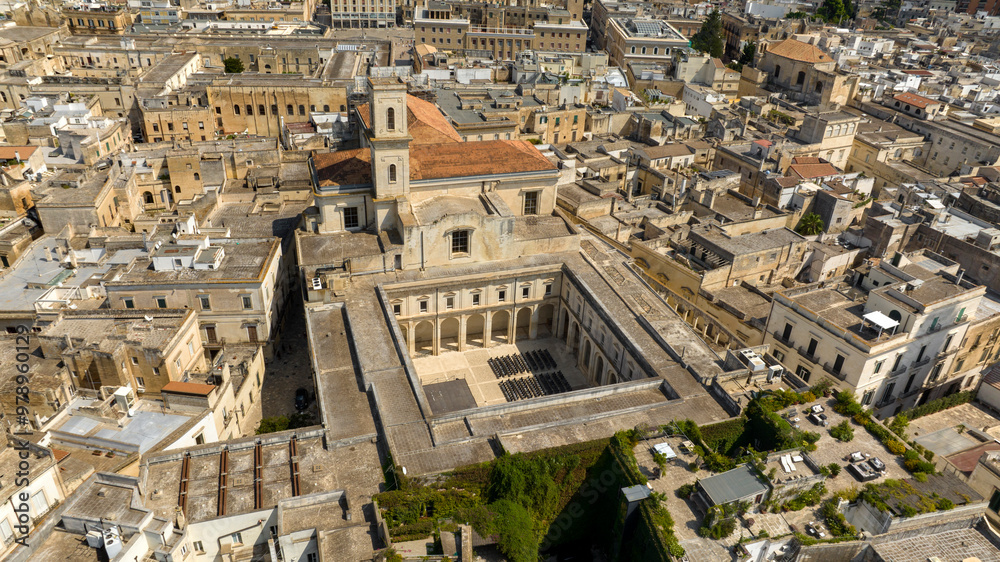 Fototapeta premium Aerial view of the church of Santa Irene in the historic center of Lecce, Puglia, Italy. It is one of the main places of worship in the city and has a large courtyard.