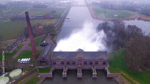 Aerial view of the historic woudagemaal pumping station with steam and water, Lemmer, Netherlands. photo