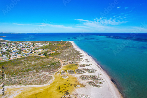 Aerial view of beautiful sandy beach and vibrant ocean waves at Thirsty Point Lookout, Cervantes, Australia. photo