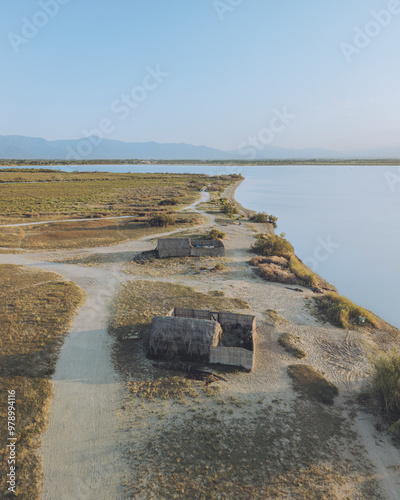 Aerial view of etang de Canet et de Saint-Nazaire with serene fisherman huts and tranquil water, Canet-en-Roussillon, France. photo