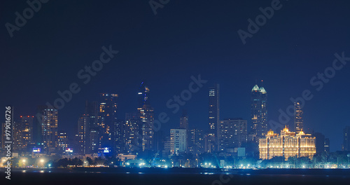 Mumbai, India. Evening City Skyline From Marine Drive , , . Back Bay Coast Of Mumbai City. Skyscrapers And Saifee Hospital In Night Illuminations photo