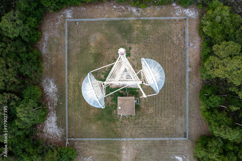 Aerial view of communications tower surrounded by forest and trees, Fellsmere, United States. photo
