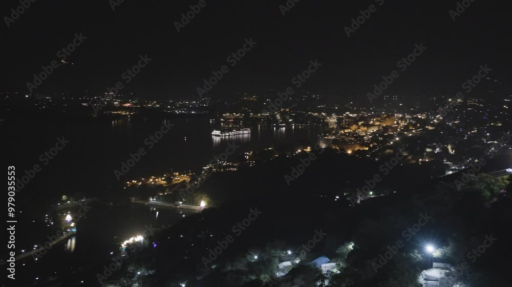 Night View of Lake City with Dramatic Lighting from Unique Perspective