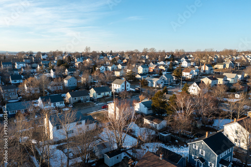 Aerial view of a picturesque residential neighborhood with serene homes and tranquil trees in winter, Sydney City, Canada. photo