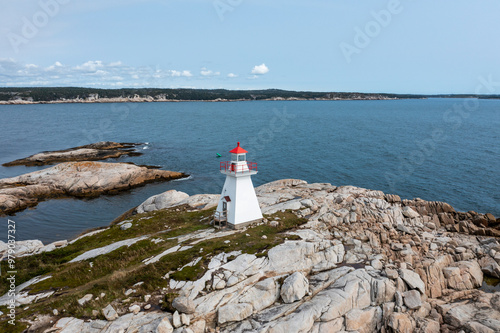 Aerial view of terence bay coastal scenery with a picturesque lighthouse and rocky coast, terence bay, nova scotia, canada. photo