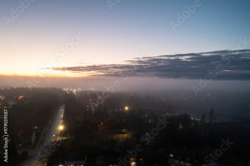 Aerial view of Halifax city skyline at dusk with city lights and fog, Bridgeview, Canada. photo